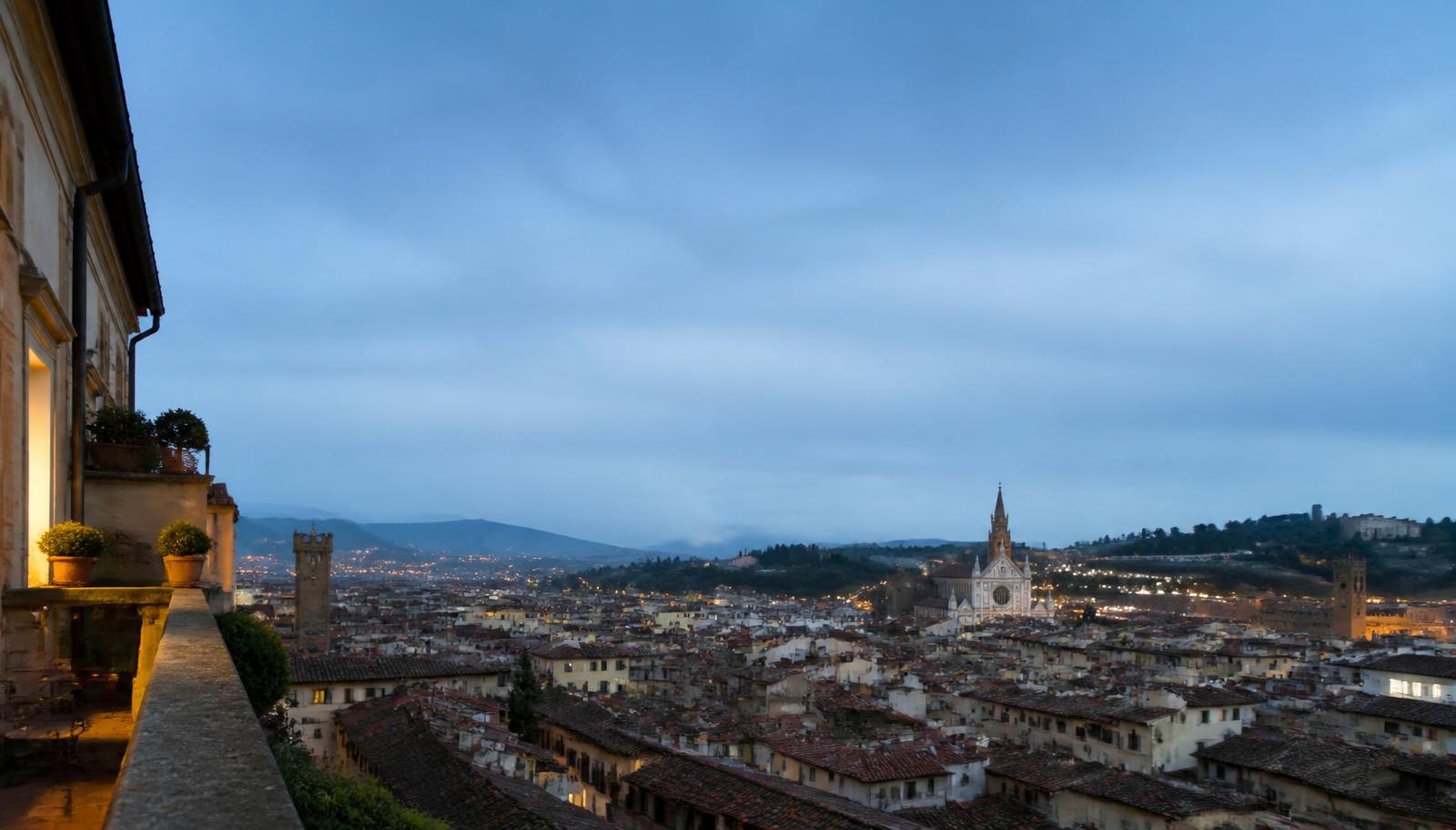 Blue hour view over an old town from a balcony